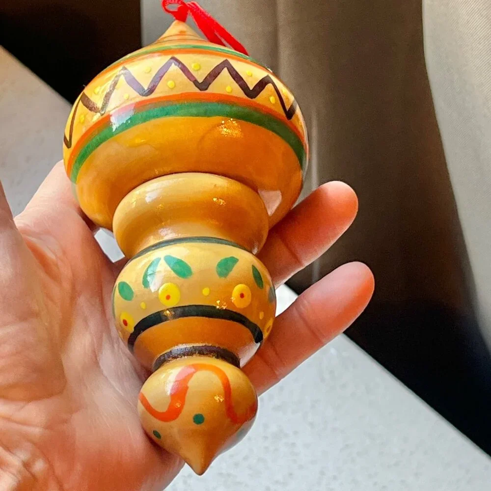 Handcrafted Wooden Hanging Ornament With Vibrant Tribal Patterns
